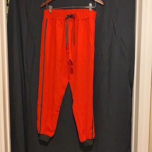 alexis ode striped track pants red